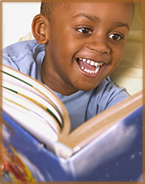 Young Boy Excited About Reading!