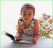 Image of a happy child reading a book